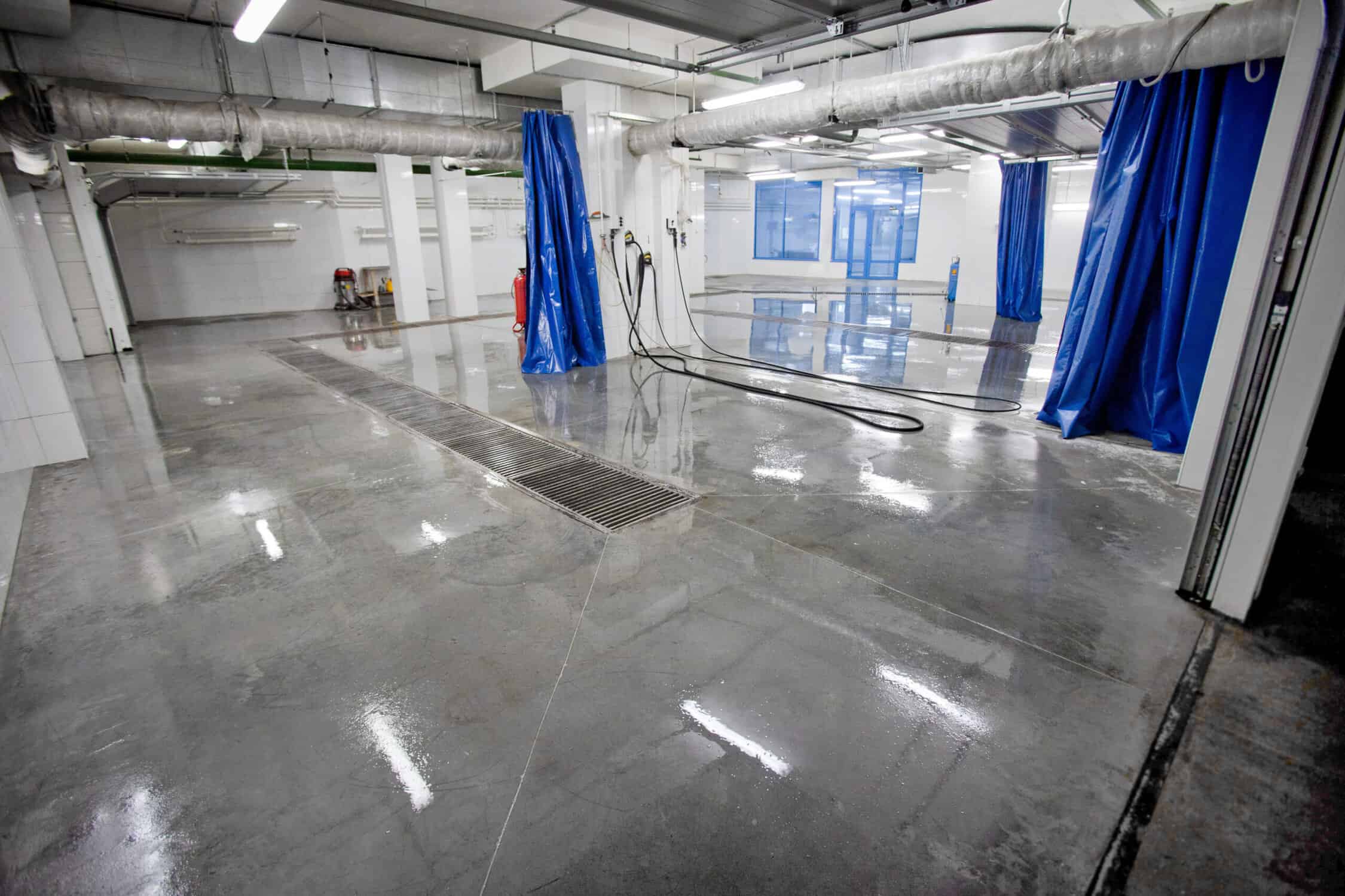 interior space car wash with a pump in the foreground