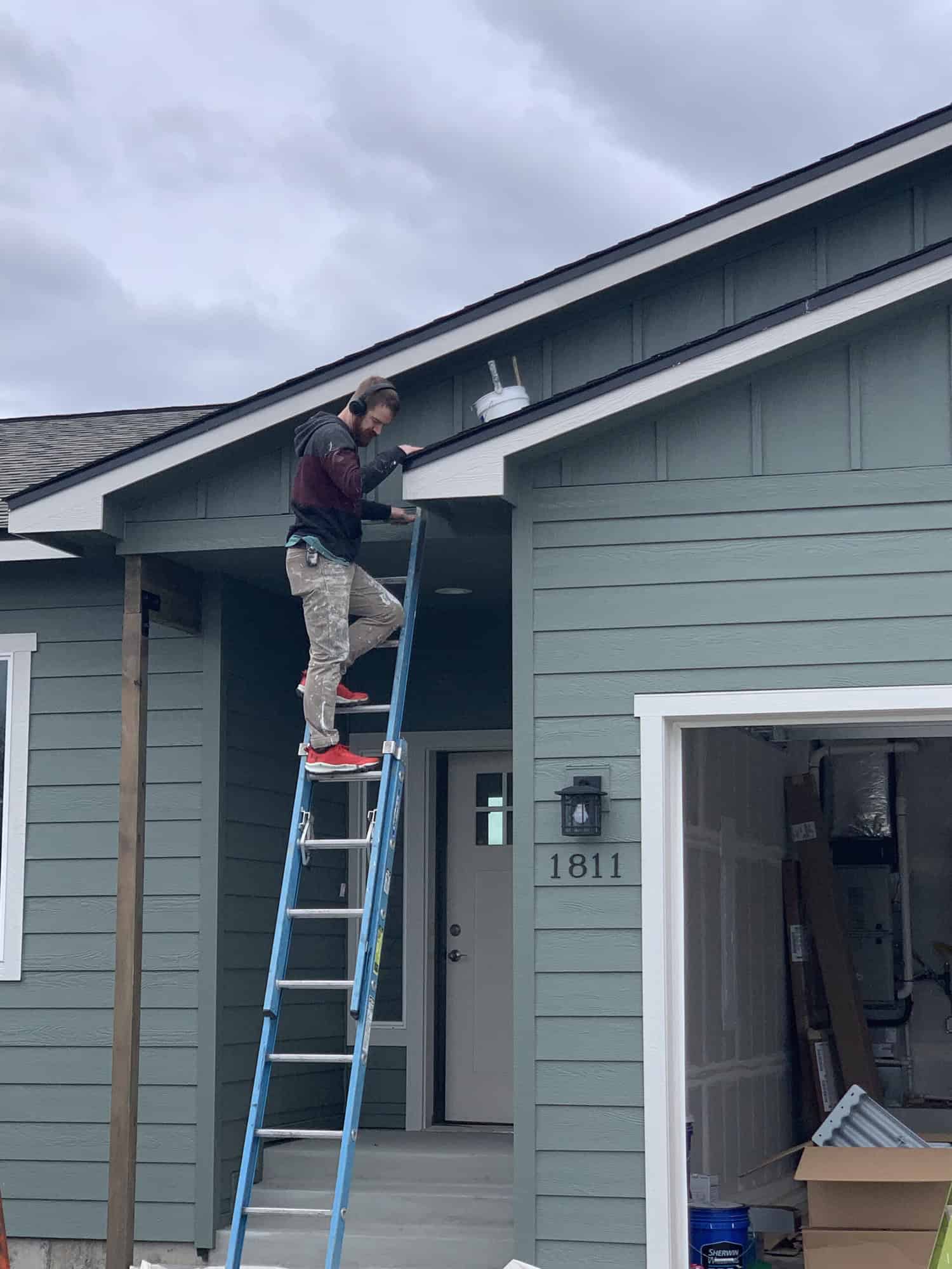 painter painting the roof